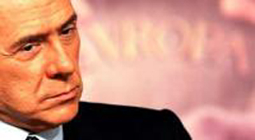 صحيفة: برلوسكوني يريد بيع ميلان للقذافي