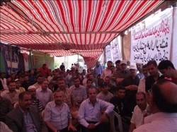 موظفو "الوطنية لصناعة الكوابل" يواصلون إضرابهم