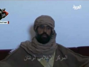 سيف الإسلام في أول حديث بعد اعتقاله: جروح يدي بسبب غارة للحلف الصليبي الكافر