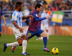 ثلاثية ميسي تقود برشلونة لفوز كبير على ملقا