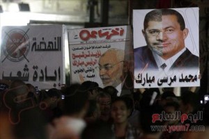 مصر : صورة لنصف وجه مرسي و الآخر لمبارك [محمد مرسي مبارك]