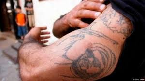 وشم شيعي يفضح هوية مقاتل في الحر وصل مستشفى الرمثا متوفياً