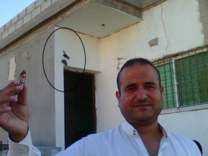 بالصور...عيارات ناريه سوريه تستقر على أحد المنازل في منطقة عقربا بمحافظة اربد