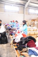 " بنك القاهرة عمان " يشارك في فرز التبرعات لبنك الملابس